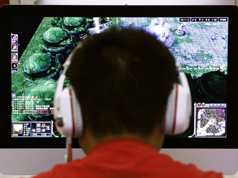 A man plays a computer game at an internet cafe in Beijing May 9, 2014. As growing numbers of young people in China immerse themselves in the cyber world, spending hours playing games online, worried parents are increasingly turning to boot camps to crush addiction. Military-style boot camps, designed to wean young people off their addiction to the internet, number as many as 250 in China alone. Picture taken May 9, 2014. REUTERS/Kim Kyung-Hoon (CHINA - Tags: SOCIETY)ATTENTION EDITORS - PICTURE 01 OF 33 FOR PACKAGE 'CURING CHINA'S INTERNET ADDICTS'TO FIND ALL IMAGES SEARCH 'INTERNET BOOT CAMP'