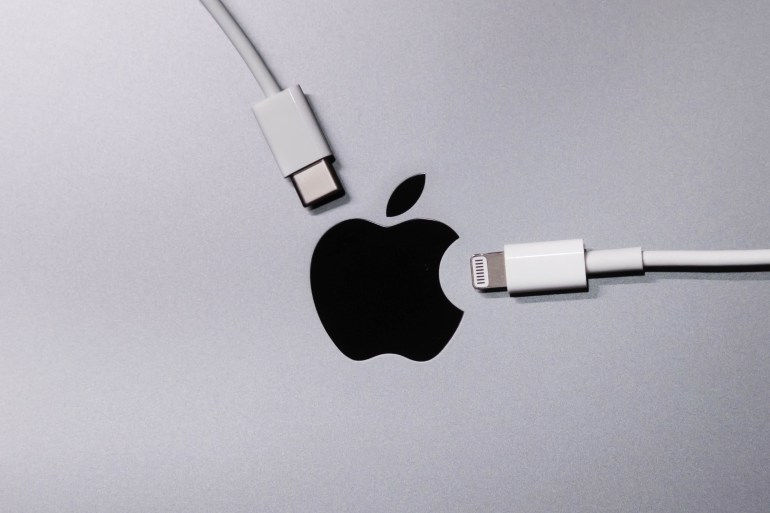 BANGKOK,THAILAND-OCTOBER 10:Apple Logo with Lighting and Usb-c Cable Charger on October 10,2021. EU try to Forced Apple Iphone to Use Usb-c Instead of Lighting Cable in the Nearly Future