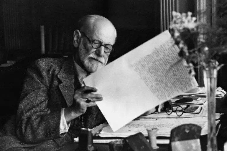 Freud In London, 1938. Austrian Neurologist And Founder Of Psychoanalysis. Reading His Manuscript Of 'An Outline Of Psychoanalysis,' 1938.