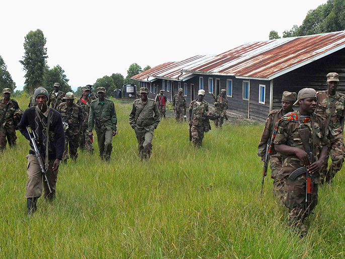 M23 rebels take position near the town of Mutaho, in eastern Democratic Republic of Congo May 27, 2013. Exactly what General Sultani Makenga is contemplating for his M23 rebels is a matter of some urgency, both for a government that has struggled to contain the revolt and for a new U.N. force tasked with disarming Congo's insurgent groups. To match Interview CONGO-DEMOCRATIC/WARLORD REUTERS/Jonny Hog (DEMOCRATIC REPUBLIC OF CONGO - Tags: CIVIL UNREST POLITICS CONFLICT)