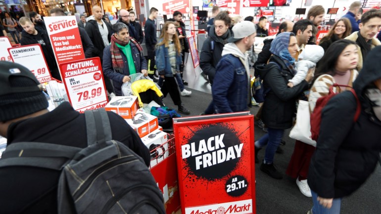 People shop during Black Friday deals at consumer electronics retailer Media Markt near Alexander Platz square in Berlin, Germany, November 29, 2019. REUTERS/Fabrizio Bensch