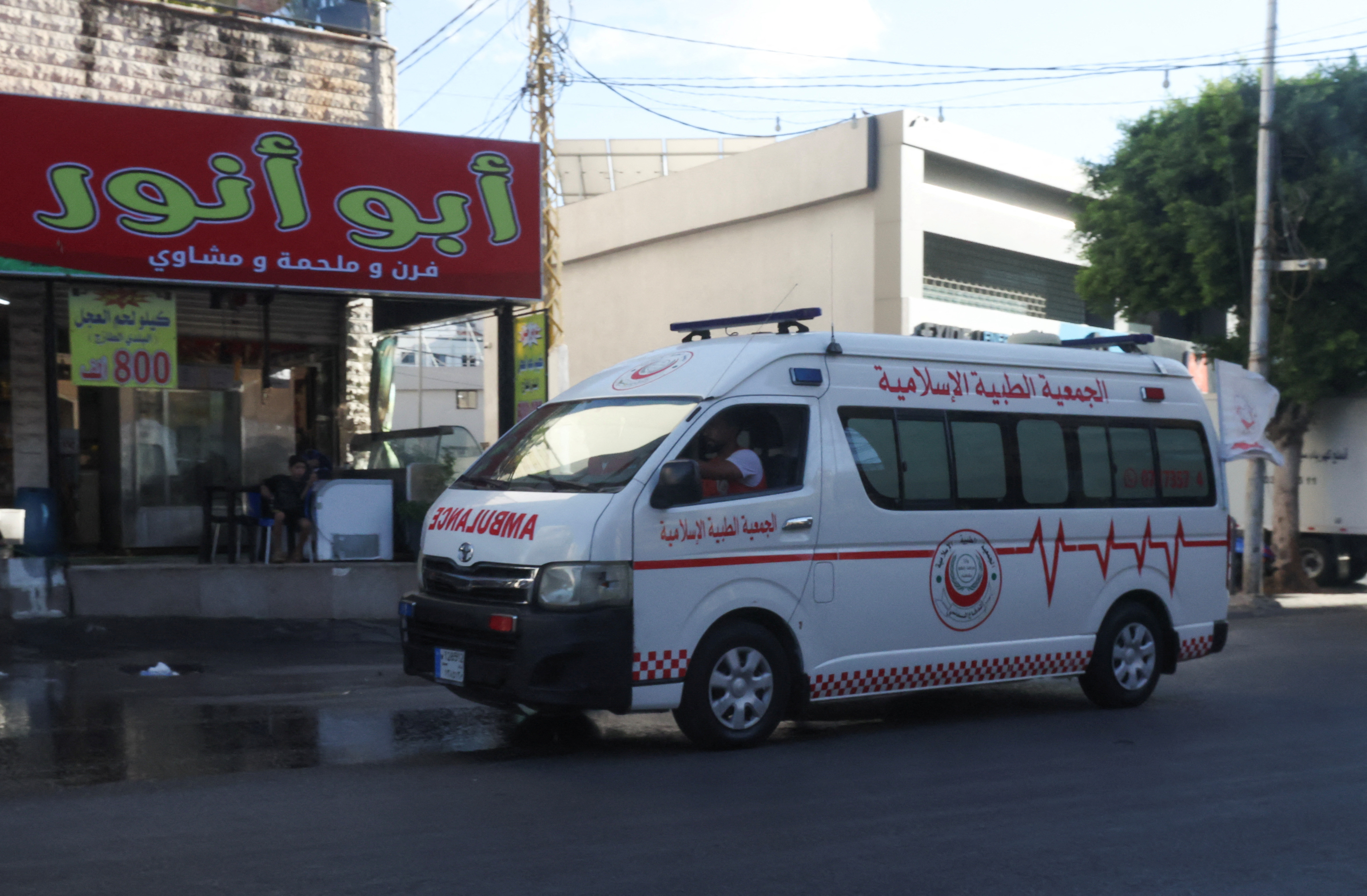 An ambulance vehicle drives as hundreds of members of the Lebanese armed group Hezbollah, including fighters and medics, were seriously wounded on Tuesday when the pagers they use to communicate exploded, according to a security source, in Sidon