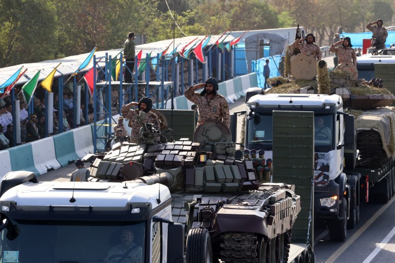 Iranian army tanks are displayed during the annual military parade marking the anniversary of the outbreak of the 1980-1988 war with Saddam Hussein's Iraq, in Tehran on September 21, 2024. (Photo by ATTA KENARE / AFP)