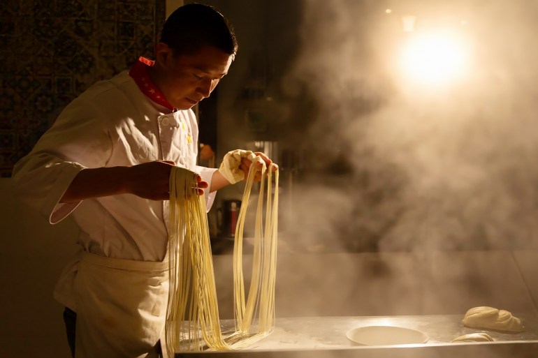 A chef making hand-pulled noodles anzhou, China Getty-1951098749