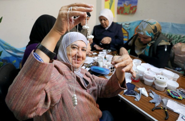 Syrian refugee presents a necklace and earrings she crafted at a United Nations Population Fund, safe space for refugee women and girls residing in Cairo, Egypt October 29, 2018. Picture taken October 29, 2018. REUTERS/Mohamed Abd El Ghany