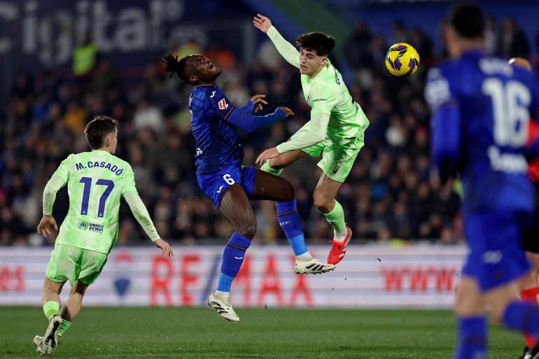 GETAFE, SPAIN - JANUARY 18: (L-R) Marc Casado of FC Barcelona, Christantus Uche of getafe, Pau Cubarsi of FC Barcelona during the LaLiga EA Sports match between Getafe v FC Barcelona at the Coliseum Alfonso Perez on January 18, 2025 in Getafe Spain (Photo by Eric Verhoeven/Soccrates/Getty Images)