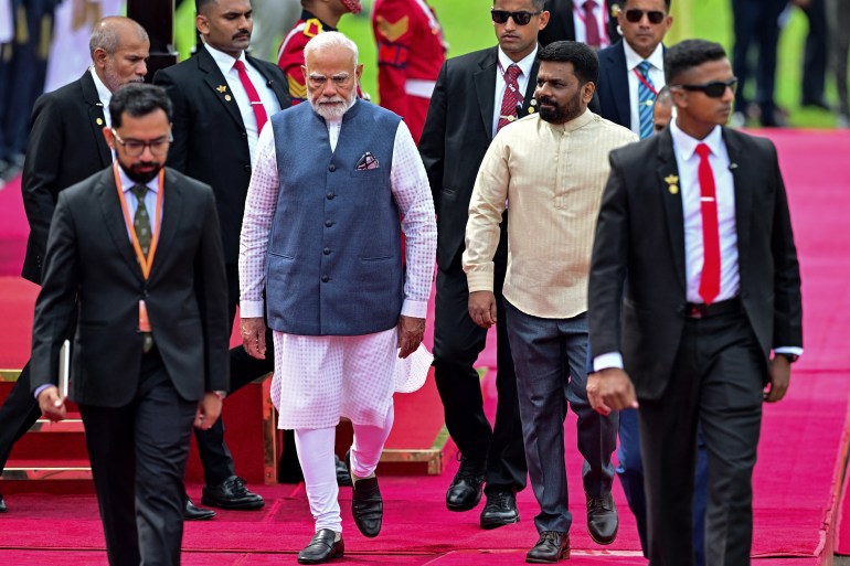 Sri Lanka's President Anura Kumara Dissanayake (center R) attends the ceremonial reception of India's Prime Minister Narendra Modi (4L) at the Independence Square in Colombo on April 5, 2025. (Photo by Ishara S. KODIKARA / AFP)