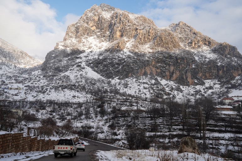 People visit the snow covered mountains in the town of Amadiyah, located about 75 kilometres north of the city of Dohuk in the autonomous Iraqi Kurdistan region, on February 14, 2025. (Photo by Ismael ADNAN / AFP)