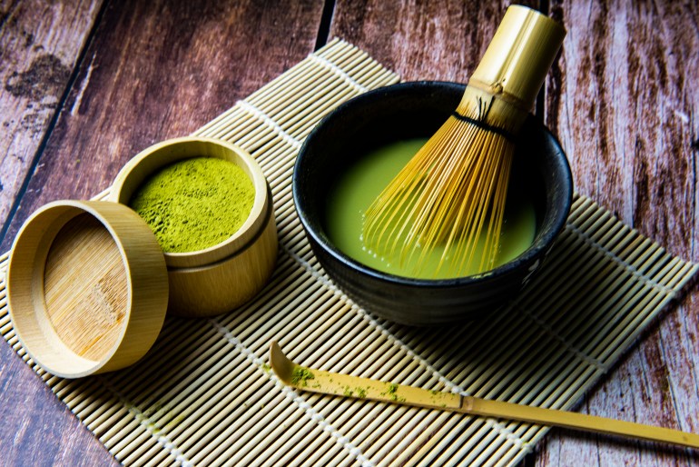 Matcha Green Tea and Japanese tea set on Wooden Background