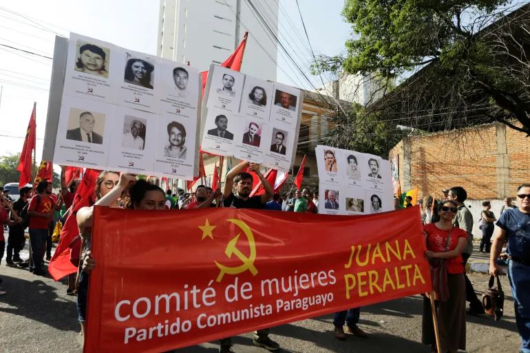 Paraguayans commemorate the 30th anniversary of the end of Alfredo Stroessner’s dictatorship in Asuncion, Paraguay on February 2, 2019 [Jorge Adorno/Reuters]