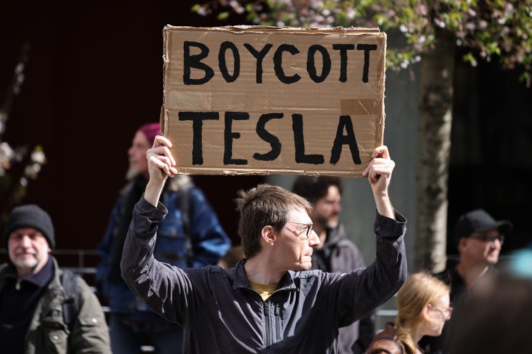 Activists Protest Against Elon Musk At Tesla Store In Berlin