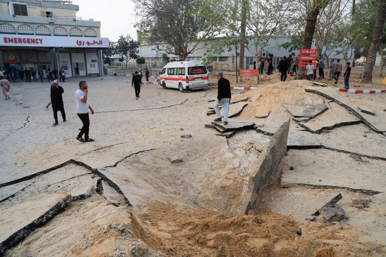 Palestinians inspect the damage at the European Hospital, which was partially damaged following Israeli airstrikes, according to the Gaza Health Ministry, in Khan Younis, in the southern Gaza Strip, May 13, 2025. REUTERS/Hatem Khaled