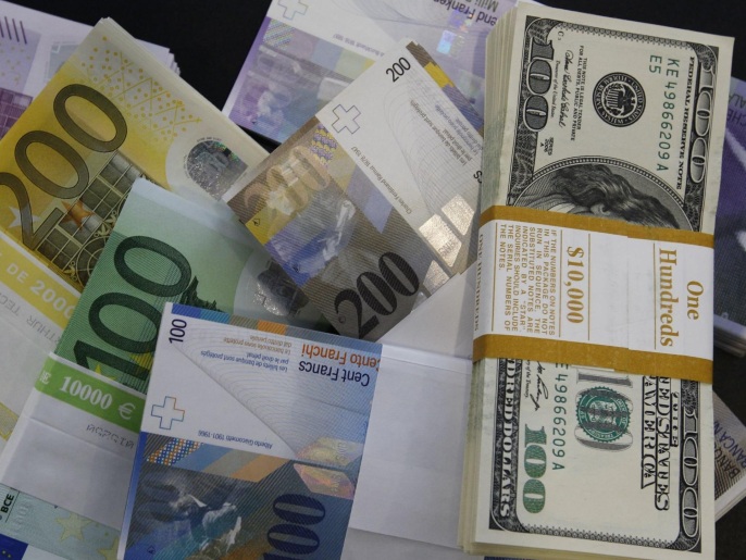 File photo of stacks of Swiss franc, Euro and U.S. dollar banknotes displayed in a bank in Bern August 15, 2011. REUTERS/Pascal Lauener/Files