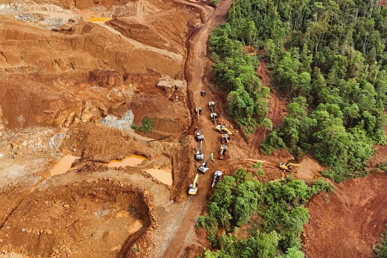 Conditions of Nickel Mining Views in Indonesia Accompanied by Beautiful Views of the Sky and Sea.