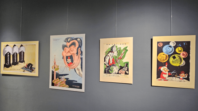 7-ـ-تُظهر-الرسوم-المعروضة-في-معرض-أيقونات-الأفيون-كيف-تم-تصوير-الدين-ورموزه-كأقنعة-ساخرة-أو-مشوهة-من