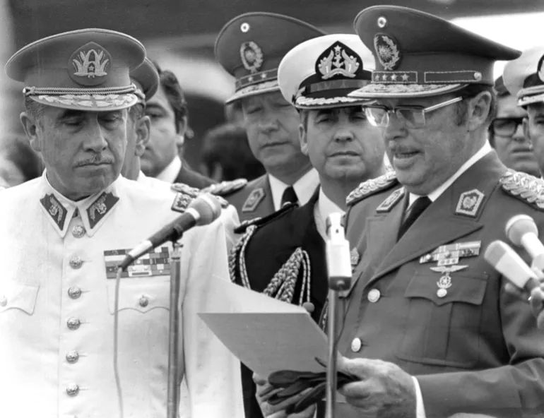 Former Paraguayan dictator General Alfredo Stroessner, right, is seen with former Chilean dictator General Augusto Pinochet on May 14, 1974 in Asuncion, Paraguay [Eduardo Di Baia/AP]