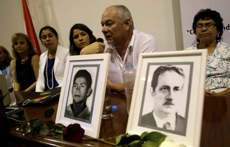 Human rights group Verdad, Justicia y Reparacion (Truth, Justice and Amends) holds a ceremony to honour the returned remains of people who went missing during the dictatorship government of Alfredo Stroessner in Asuncion, Paraguay, on February 10, 2017 [Jorge Adorno/Reuters]