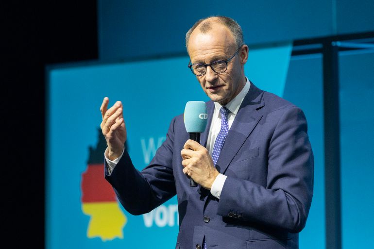 BERLIN, GERMANY - FEBRUARY 20: Friedrich Merz, chancellor candidate of Germany's Christian Democrats (CDU/CSU), speaks to voters during an election campaign tour stop on February 20, 2025 in Berlin, Germany. Merz is currently leading in polls ahead of snap federal parliamentary elections scheduled for February 23. (Photo by Maja Hitij/Getty Images)