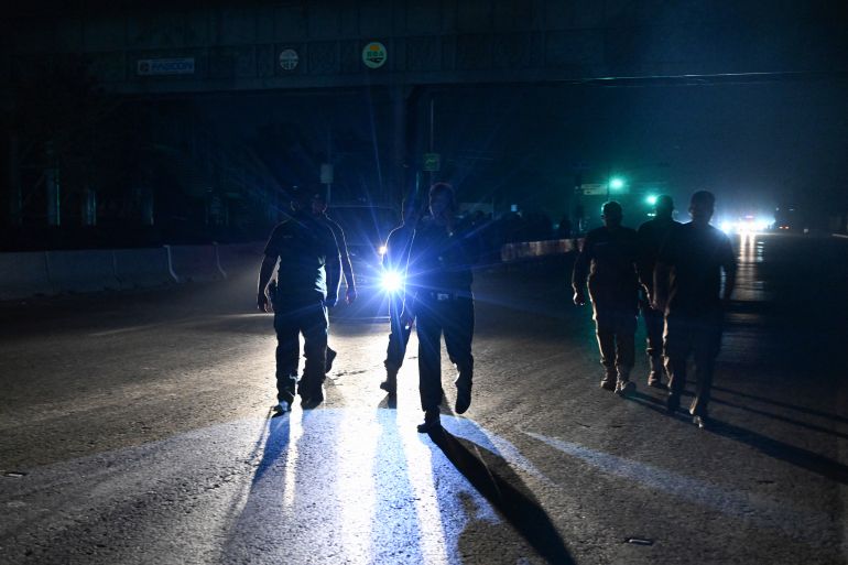 Security personnel cordon off a road near Nur Khan military airbase after Indian strikes in Rawalpindi on May 10, 2025. Pakistan's military on May 10 said India launched another wave of missiles targeting three air bases -- including one on the outskirts of the capital -- as the conflict between the nuclear-armed neighbours spiralled toward full-blown war. (Photo by Aamir QURESHI / AFP)