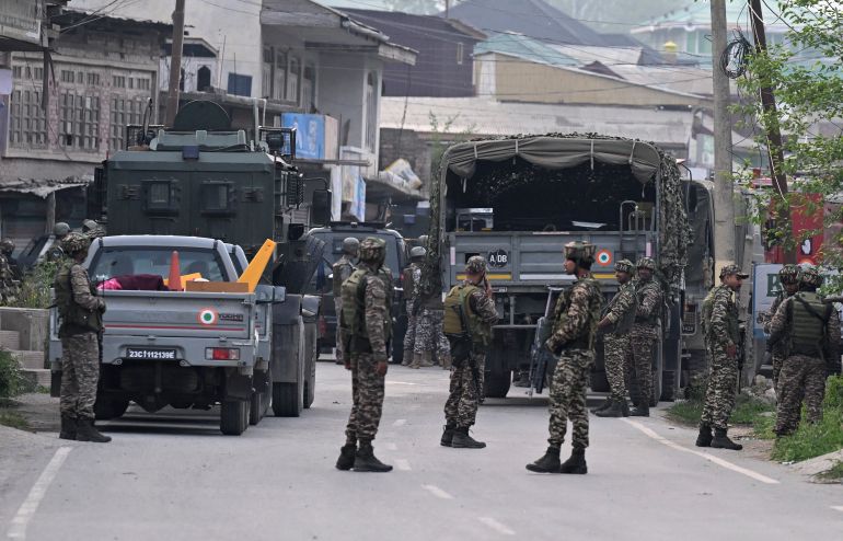 Indian security personnel stand guard in Wuyan near Indian-administered Kashmir's main city of Srinagar on May 7, 2025.