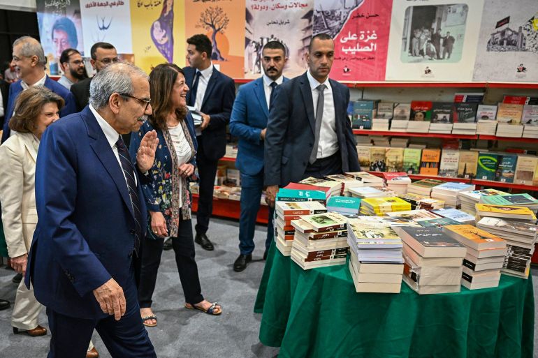 Lebanon's Prime Minister Nawaf Salam (L) visits the 66th Beirut Arab International Bookfair in the Lebanese capital on May 15, 2025. (Photo by Joseph EID / AFP)