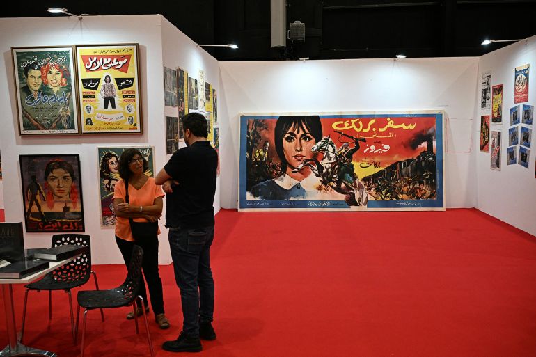 Lebanon's Prime Minister Nawaf Salam (L) visits the 66th Beirut Arab International Bookfair in the Lebanese capital on May 15, 2025. (Photo by Joseph EID / AFP)