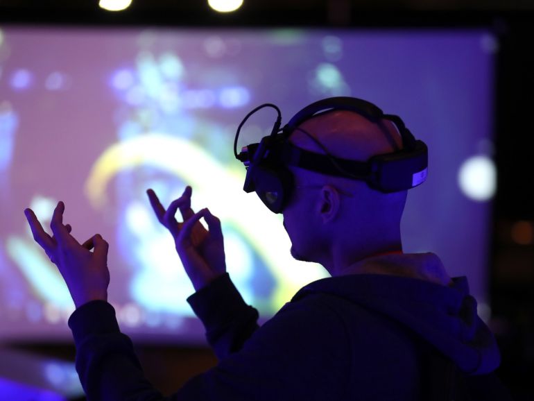 SANTA CLARA, CALIFORNIA - MAY 30: An attendee tries out Realmax augmented reality glasses during the AWE Expo (Augmented World Expo) at the Santa Clara Convention Center on May 30, 2019 in Santa Clara, California. The Augmented Word Expo highlights the latest virtual and augmented reality technology and features industry speakers. Over 7,000 people will attend the three day expo that runs through May 31. Justin Sullivan/Getty Images/AFP== FOR NEWSPAPERS, INTERNET, TELCOS & TELEVISION USE ONLY ==
