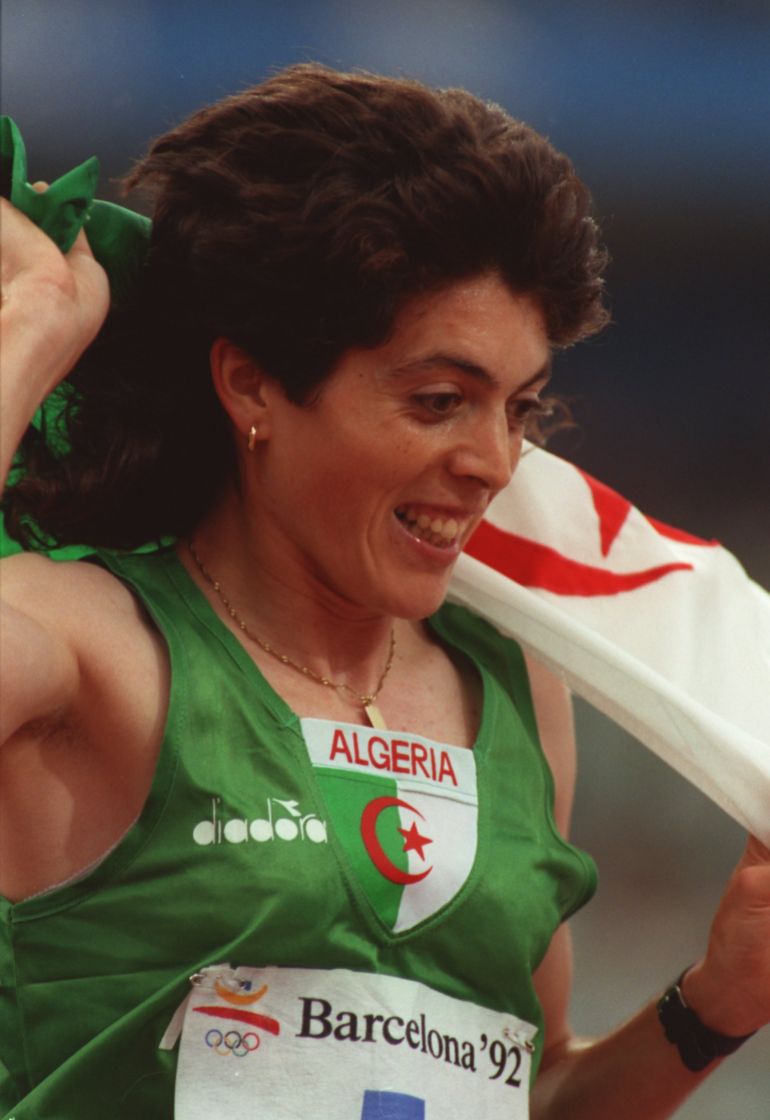 1992: HASSIBA BOULMERKA OF ALGERIA CELEBRATES HER WIN IN THE WOMENS 1500 METRES AT THE 1992 OLYMPICS IN BARCELONA. Mandatory Credit: Pascal Rondeau/ALLSPORT