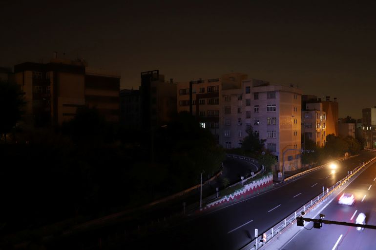Apartments are seen with the lights off while electricity is cut off due to energy savings in Tehran, Iran, July 4, 2021. Picture taken July 4, 2021. Majid Asgaripour/WANA (West Asia News Agency) via REUTERS ATTENTION EDITORS - THIS IMAGE HAS BEEN SUPPLIED BY A THIRD PARTY.