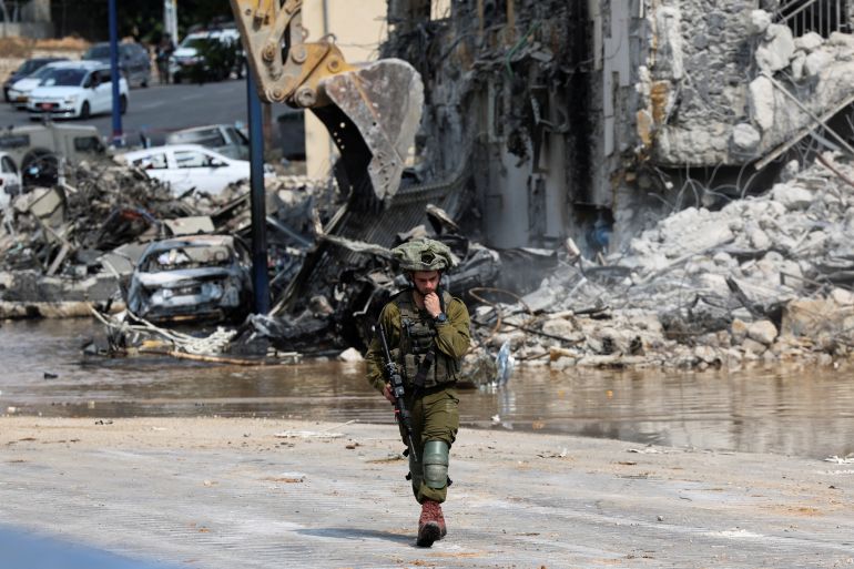 An Israeli soldier patrols near a police station which was the site of a battle following a mass infiltration by Hamas gunmen from the Gaza Strip, in Sderot, southern Israel October 8, 2023. REUTERS/Ronen Zvulun