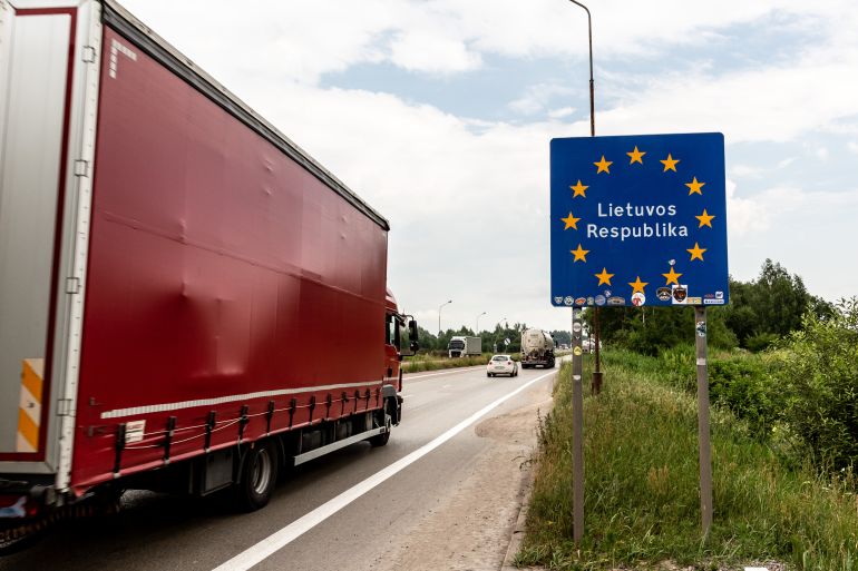 A lorry with goods passes the Lithuanian border sign to enter Lithuania on June 29, 2022 at Polish-Lituanian border on the busy E67 road. The Polish border with Lithuania is situated between Kaliningrad oblast (part of Russia) and Belarus and stretches 100 kilometers. The Area is called Suwalki Gap and is the only connection between Baltic States and the rest of the NATO and European Union. After Lithuania refused to transport sanctioned goods via rail from Russia's mainland to Kaliningrad, Vladimir Putin, Russian president, threatened Lithuania with serious consequences. Both NATO and European Union worry that Suwalki Gap, a relatively narrow corridor with Baltic States can be attacked by Russia