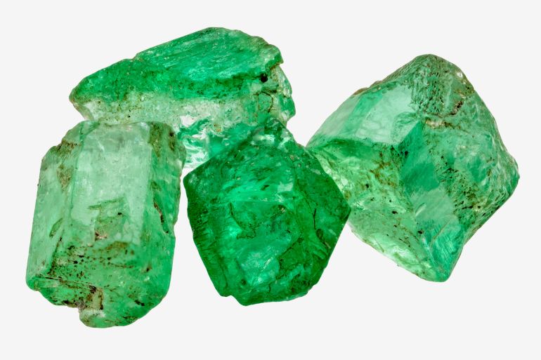 Four rich green emerald crystals on white; Shutterstock ID 164544929; purchase_order: 4; job: ; client: ; other: