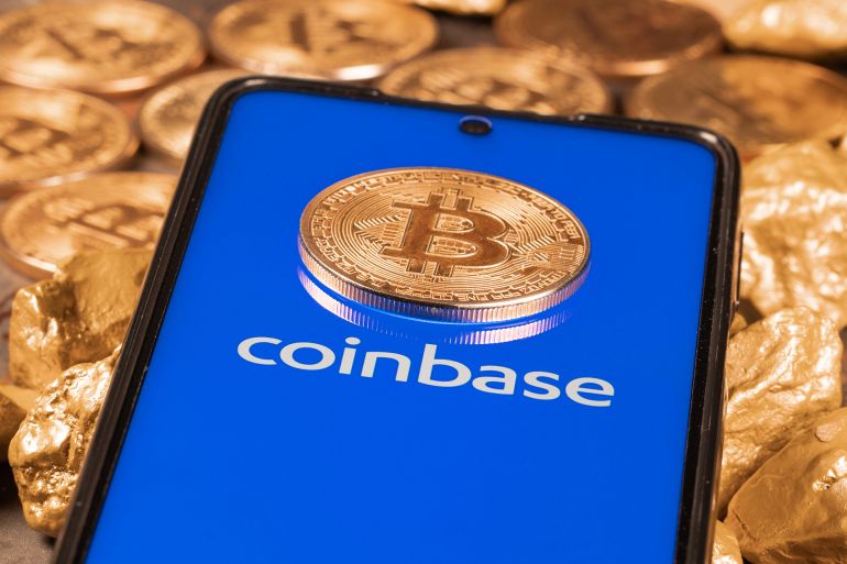 Coinbase crypto exchange logo on screen with Bitcoin coins. Ljubljana, Slovenia - April 12 2021; Shutterstock ID 1954704901; purchase_order: aj; job: ; client: ; other: