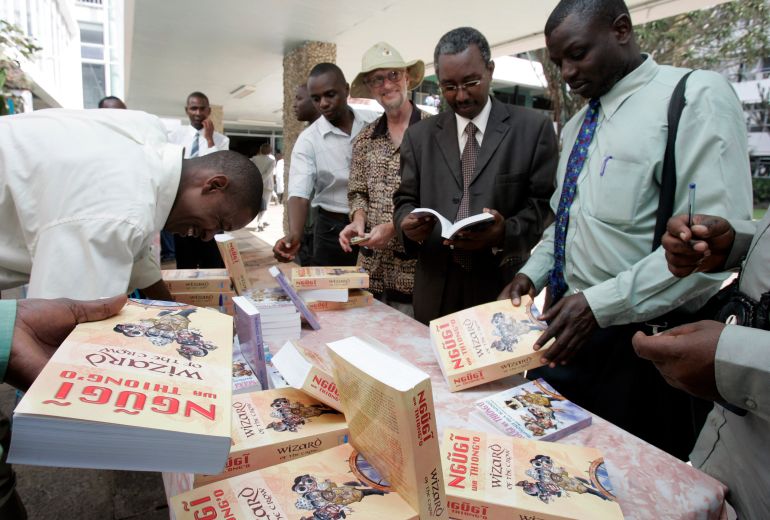 Students and staff buy the newly launched book "Wizard of the Crow" by Ngugi Wa Thiong'o at the University of Nairobi January 15, 2007. The book, which took Wa Thiong'o more than six years to write, was released on Monday, about 20 years after the author's novel "Matigari". REUTERS/Antony Njuguna (KENYA)