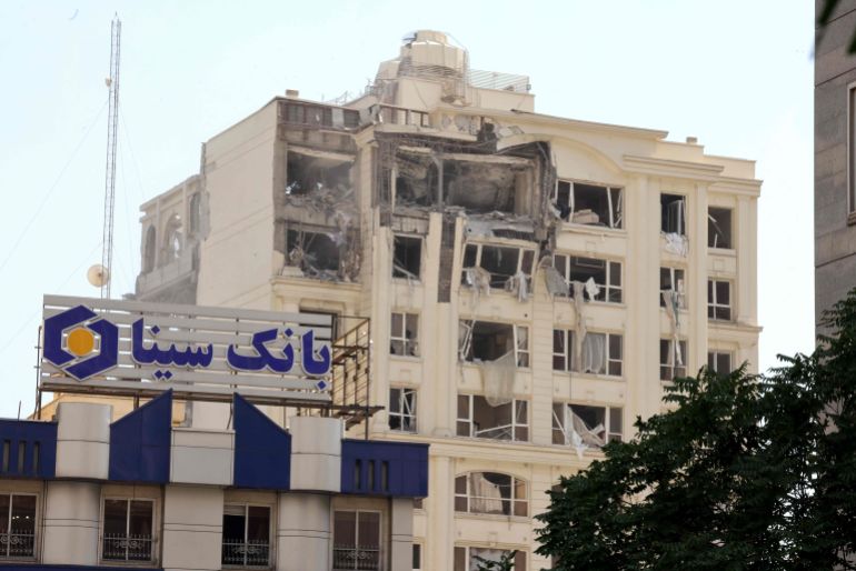 CORRECTION / This picture shows a building damaged in an Israeli strike on Tehran on June 13, 2025. Israel hit about 100 targets in Iran on June 13, including nuclear facilities and military command centres and killing senior figures including the armed forces chief and top nuclear scientists. (Photo by Atta KENARE / AFP) / The erroneous mention[s] appearing in the metadata of this photo by MEGHDAD MADADI has been modified in AFP systems in the following manner: [Atta KENARE] instead of [Meghdad MADADI]. Please immediately remove the erroneous mention[s] from all your online services and delete it (them) from your servers. If you have been authorized by AFP to distribute it (them) to third parties, please ensure that the same actions are carried out by them. Failure to promptly comply with these instructions will entail liability on your part for any continued or post notification usage. Therefore we thank you very much for all your attention and prompt action. We are sorry for the inconvenience this notification may cause and remain at your disposal for any further information you may require.