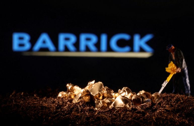 FILE PHOTO: A small toy figure and gold imitation are seen in front of the Barrick logo in this illustration taken November 19, 2021. REUTERS/Dado Ruvic/Illustration/File Photo/File Photo