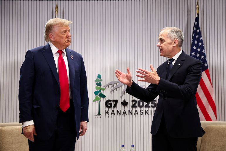 U.S. President Donald Trump meets with Canadian Prime Minister Mark Carney at the G7 summit in Kananaskis, Alberta, Canada, June 16, 2025. REUTERS/Kevin Lamarque