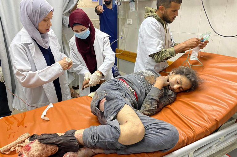 Palestinian doctors caring for a girl who was injured in Israeli air strikes, at the Nasser hospital in Khan Yunis in the southern Gaza Strip, on May 15, 2025. Gaza rescuers said Israeli strikes and shelling on May 15 killed 82 people in the war-battered Palestinian territory, updating a previous toll.PHOTO: AFP