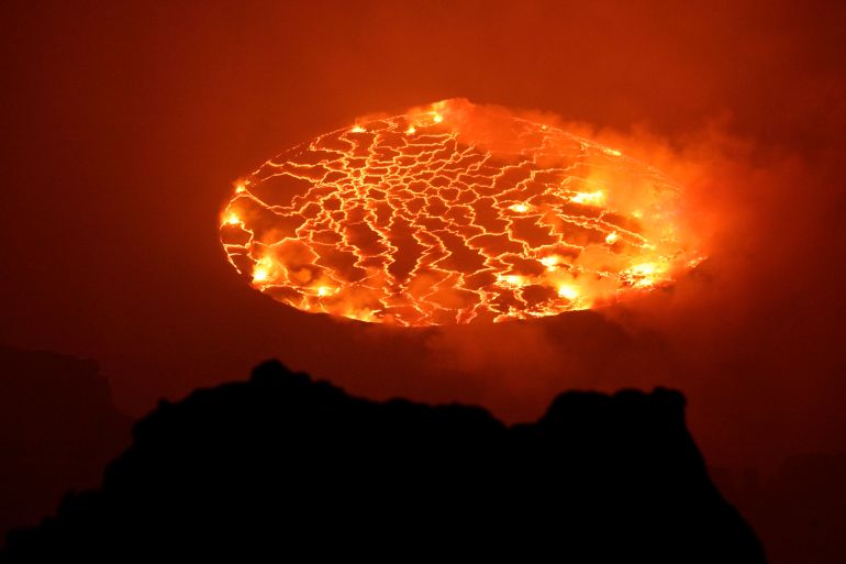 In this March 31, 2010 photo, magma churns and gushes in the lava lake of Mount Nyiragongo, one of Africa's most active volcanos, outside Goma, Congo. Mount Nyiragongo is the ultimate symbol of death in Goma, the lakeside city it shadows and has overrun several times. Yet it's also a symbol of rebirth and resilience for a nation slowly emerging from war. In March, park rangers cleared Rwandan militias from its slopes and reopened the summit for the first time in a year and a half. (AP Photo/Rebecca Blackwell)