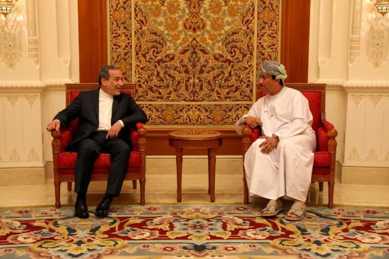 Iran's Foreign Minister Abbas Araghchi is welcomed by an unidentified Omani official upon his arrival in Muscat, Oman, May 11, 2025. Iranian Foreign Ministry/WANA (West Asia News Agency)/Handout via REUTERS ATTENTION EDITORS - THIS PICTURE WAS PROVIDED BY A THIRD PARTY