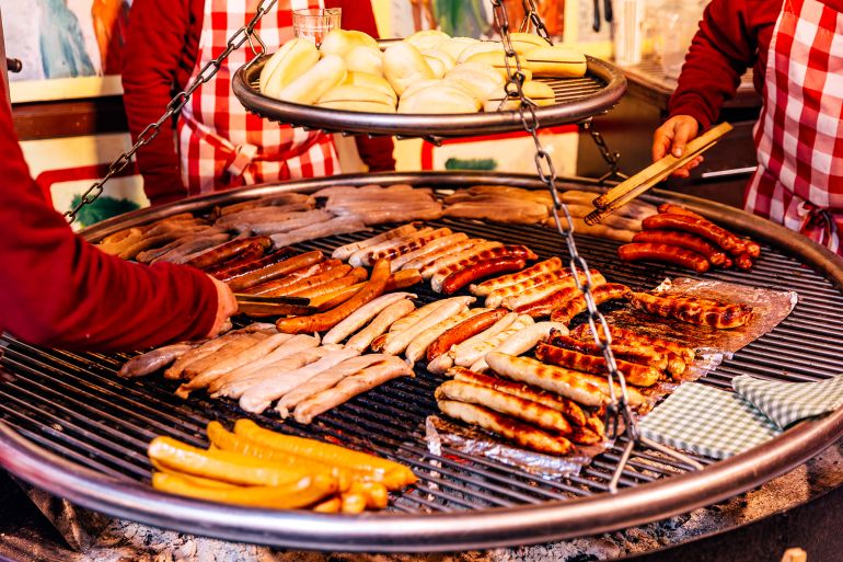 Bratwurst sausages grilled at Christmas Market, Berlin, Germany - stock photo
