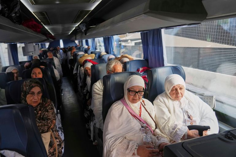 Algerian pilgrims ride a bus from Mecca to Arafat, during the annual Hajj pilgrimage, in the Muslim holy city of Mecca, Saudi Arabia, Wednesday, June 4, 2025. (AP Photo/Amr Nabil)