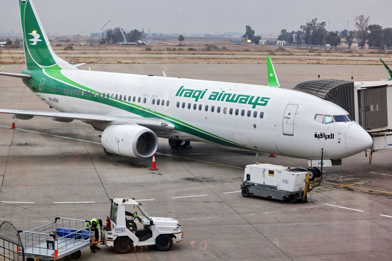 An Iraqi Airways aircraft is parked at the gate at Baghdad airport on February 20, 2025