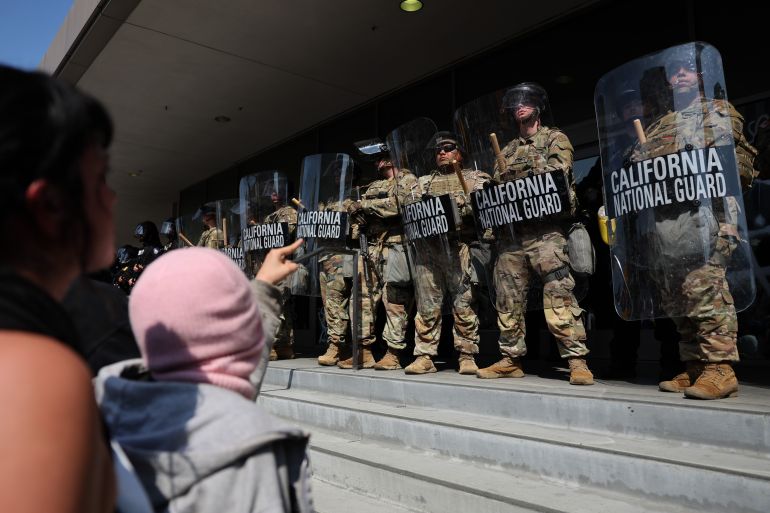 epa12167403 Protestors confront the California National Guard as they protect the Federal Building during protests sparked by immigration raids in Los Angeles, California, USA, 09 June 2025. US President Donald Trump has deployed 2,000 National Guard troops, despite not receiving a request from the state of California for any additional assistance, following large protests against ongoing immigration enforcement raids in the Los Angeles area over the last couple of days. EPA-EFE/ALLISON DINNER