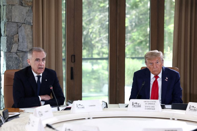 U.S. President Donald Trump and Canadian Prime Minister Mark Carney attend a meeting with G7 leaders and guests, at the G7 summit in Kananaskis, Alberta, Canada, June 16, 2025. REUTERS/Kevin Lamarque REFILE - CORRECTING ID FROM "PRIME MINISTER SIR KEIR STARMER" TO "CANADIAN PRIME MINISTER MARK CARNEY"