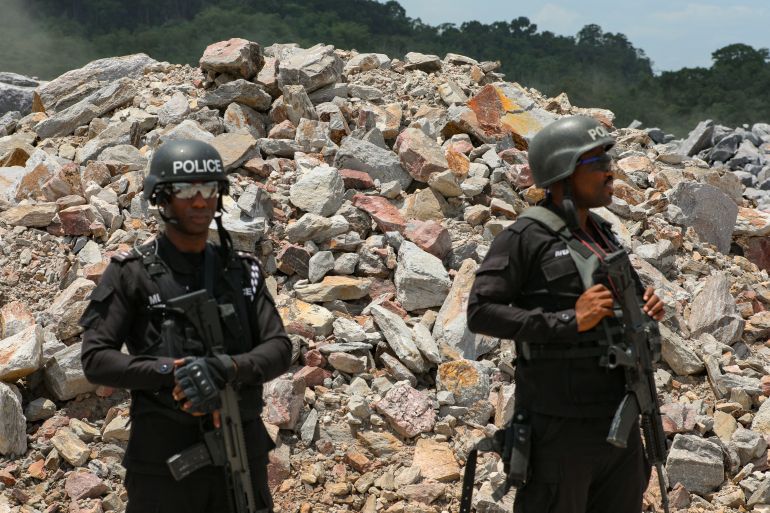 Security personnel stand watch during a drone surveillance exercise at the Gold Fields Mine in Tarkwa, Ghana, April 10, 2025. REUTERS/Francis Kokoroko