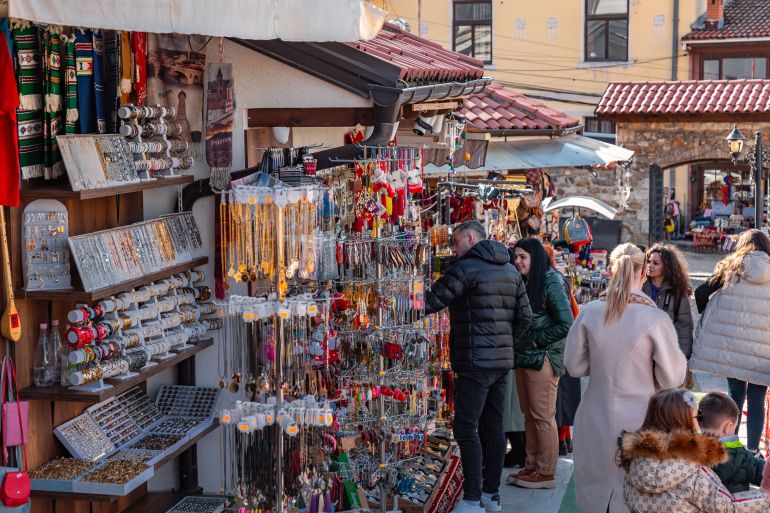 Prizren, Kosovo - 6 FEB 2024: Touristic stores and cafes around the Sinan Pasha Mosque, the most popular spot of Prizren, Kosovo.