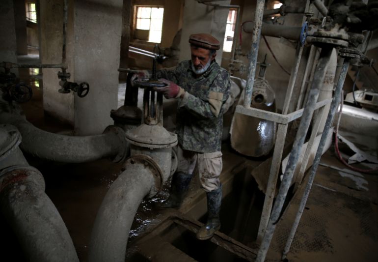 Dadullah, an employee at the Jabal Saraj cement factory, works at a plant in Jabal Saraj, north of Kabul, Afghanistan April 19, 2016. In an area desperately short of industry and jobs, local workers hope that the relaunch of the plant in Jabal Saraj, built by Czech engineers in 1957 and closed down by the Taliban in 1995, can show that Afghanistan's shattered industry can climb back to its feet after decades of war and destruction. But the outdated state-owned plant some 75 kilometres outside Kabul also shows how far it has to go before that promise can be achieved and there are serious questions over whether it has a viable future unless a new, modern facility is built to replace it. REUTERS/Ahmad Masood SEARCH "AFGHANISTAN CEMENT" FOR THIS STORY. SEARCH "THE WIDER IMAGE" FOR ALL STORIES