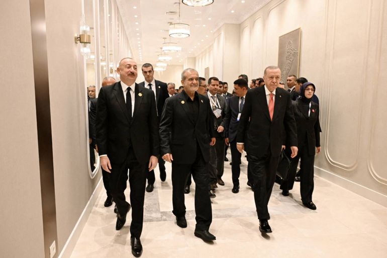 This handout photograph released by the Azerbaijani presidential press service on July 4, 2025, shows attendees, including Turkish President Recep Tayyip Erdogan, Azerbaijani President Ilham Aliyev and Iranian President Masoud Pezeshkian, taking part in the 17th Summit of the Economic Cooperation Organization in Khankendi, Azerbaijan. (Photo by Handout / Azerbaijani presidency / AFP) / RESTRICTED TO EDITORIAL USE - MANDATORY CREDIT "AFP PHOTO / AZERBAIJANI PRESIDENCY / HANDOUT / - NO MARKETING NO ADVERTISING CAMPAIGNS - DISTRIBUTED AS A SERVICE TO CLIENTS
