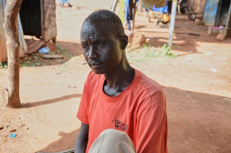 Shoemaker Emmanuel Achuil works under the shade of a tarpaulin in Wau, South Sudan, June 13, 2025. (AP Photo/Michael Atit)